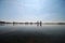 Lake named Zevenhuizerplas in Zevenhuizen with sun on the water and the skyline of Nesselande beach and district in Rotterdam.