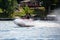 Lake Nokomis, Tomahawk, Wisconsin, USA, August, 20, 2022 - Girl on a jet ski flying across the lake