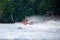 Lake Nokomis, Tomahawk, Wisconsin, USA, August, 20, 2022 - Girl on a jet ski flying across the lake