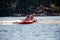 Lake Nokomis, Tomahawk, Wisconsin, USA, August, 20, 2022 -  Girls on an inflatable tube being towed across the lake