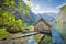 Lake Obersee with boat house in summer, Bavaria, Germany