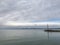 Lake pier with a lonely mooring pole