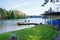 Lake pier with two blue chairs.