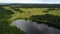 Lake Polonskoe. Fields Tractor on the road.