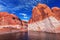 Lake Powell is surrounded by magnificent red hills. Walk on the boat at sunset. Scenic huge artificial water basin of the