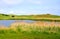 Lake, reeds and hills