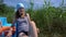 Lake reeds and mother with little daughter using catamaran. Gimbal motion