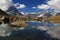 The lake Riffelsee, mountains and clouds reflected in it, on a mountain Gornergrat, near Zermatt, in southern Switzerland