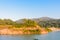 Lake, road, mountain and sky under sunshin in the morning