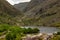 Lake, Road and mountains at Gap of Dunloe with rocks and vegetation