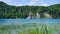 Lake Scenic with woods, reeds and people in watercraft, Bavaria, Germany