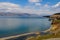 Lake Sevan is the largest body of water in Armenia and in the Caucasus region. Blue expanses of water, mountains and meadow with f