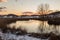 A lake shore in Colfiorito Umbria in winter with snow, trees