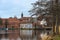 Lake shore with houses and the tower of the St. Petri church in Ratzeburg  a beautifully situated small town in northern Germany