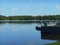 Lake shore summer landscape and fisherman in the Minsk Belarus blue sky background