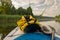 Lake shore view, foreground sup board bow with yellow waterproof bag, summer