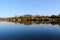 Lake shoreline reflecting in the water