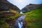 Lake and a small white church in Saksun on the Faroe islands, Denmark.