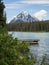 Lake and snow capped mountains with dock