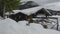 Lake Spitzingsee in winter covered with snow and ice in freezing cloudy weather in Bavaria, Germany. A mountain lake in