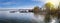 Lake Starnberg near Tutzing with boats moored to the jetties. Low standing sun