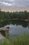 Lake in stone canyon surrounded by forest