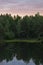 Lake in stone canyon surrounded by forest