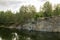 Lake in stone canyon surrounded by forest