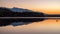 Lake sunrise landscape. Water reflection of mountain. Tatras mouuntains at background. Slovakia