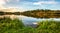 Lake at sunset. Countryside rural scenery in Poland