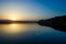 Lake at sunset with a jet passing