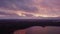 Lake sunset view with islands, aerial flight over the lake