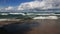 Lake Superior Waves and Beach with puffy clouds