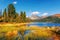 Lake Svetloye in Ergaki among the taiga rocks autumn grass in water