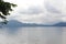 Lake Tazawa with a mountain range on the opposite shore on a cloudy day in Akita prefecture, Tohoku region in northern Japan