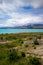 Lake Tekapo bright blue from the village shore