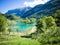 Lake Tenno surrounded by Italian alps.