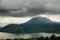 Lake Toba Danau Toba and Pusubukit Volcano under heavy clouds