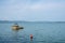 Lake Trasimeno, lake landscape with a red buoy and a concrete pier seen from the beach