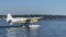 Lake Union  Seaplane Base, `Kenmore Air` DHC-3 de Havilland Otter Turboprop Seaplane is water taxiing to the take off area