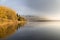 Lake Varese from Biandronno, province of Varese, Italy in an autumn morning with mist.