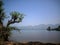 lake view surrounded by forests and mountains