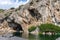 Lake Vouliagmeni in Athens is surrounded by steep cliffs