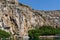 Lake Vouliagmeni in Athens is surrounded by steep cliffs