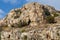 Lake Vouliagmeni in Athens is surrounded by steep cliffs