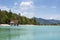 Lake Walchensee with boathouse and mountain range - Typical alpine lake in the bavarian Alps with incredible clear and turquoise