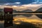 Lake wharf with a wooden pier at dawn