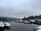 Lake Windermere, Lake District in England. Winter with snow. Calm still water with birds boats and swans