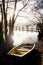 Lake windermere, a rowing boat on the shore with a wooden jetty