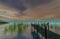 Lake and wood dock on in late afternoon, 3d rendering